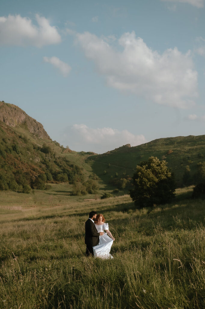 Eloping in Scotland. Arthurs Seat Elopement. Couple running through the hills of Arthurs Seat