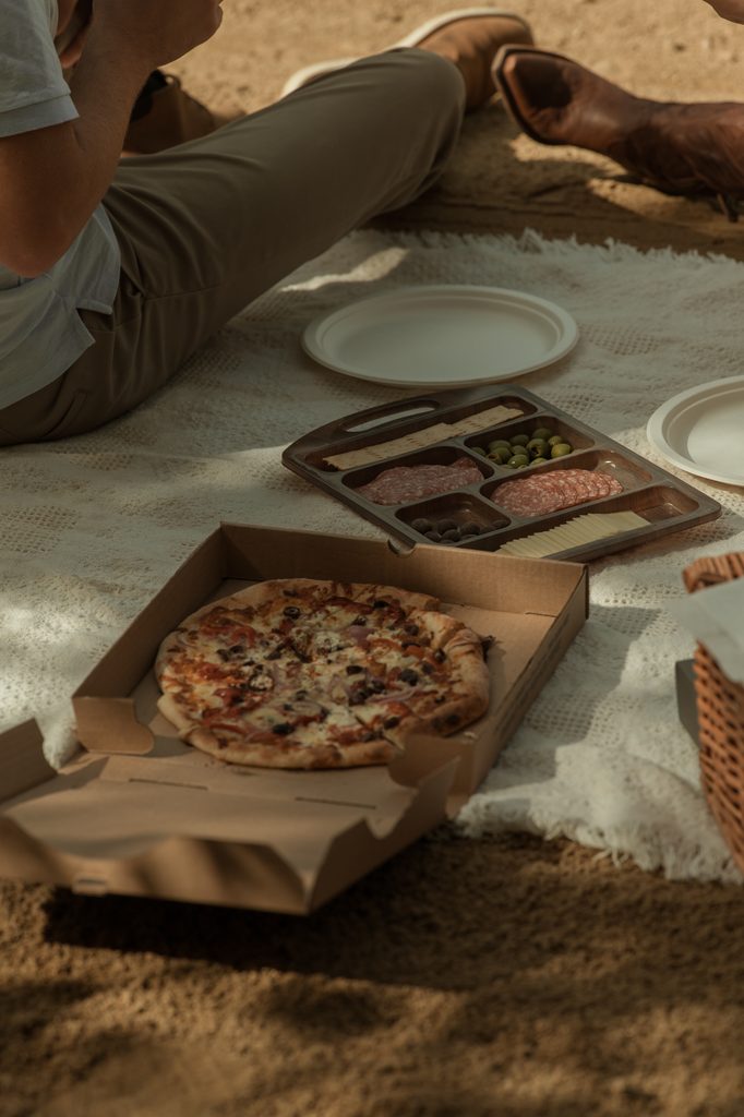 New Hampshire elopement photographer documenting a couple's picnic break during their fall wedding adventure
