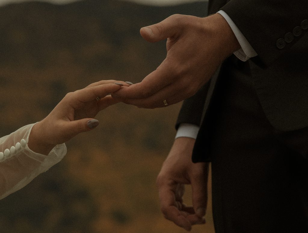 Intimate couple portraits during a fall elopement in New Hampshire with colorful autumn mountain scenery