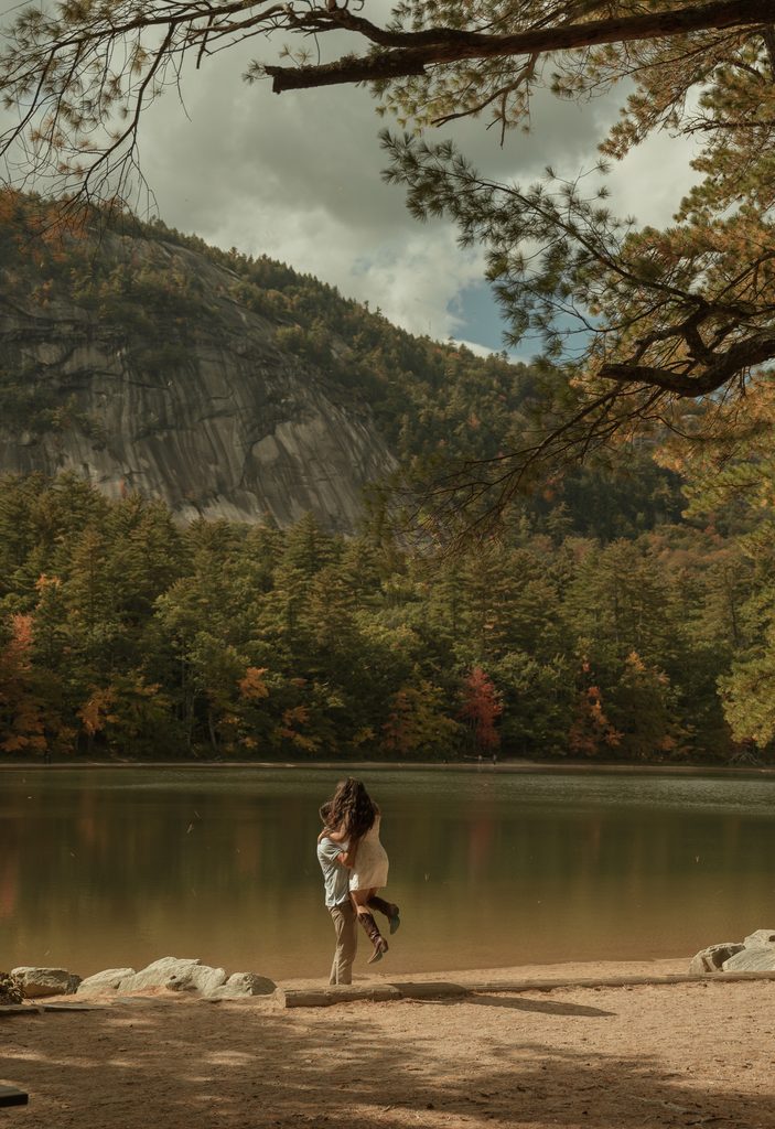 Intimate fall elopement picnic surrounded by vibrant autumn colors in the New Hampshire mountains
